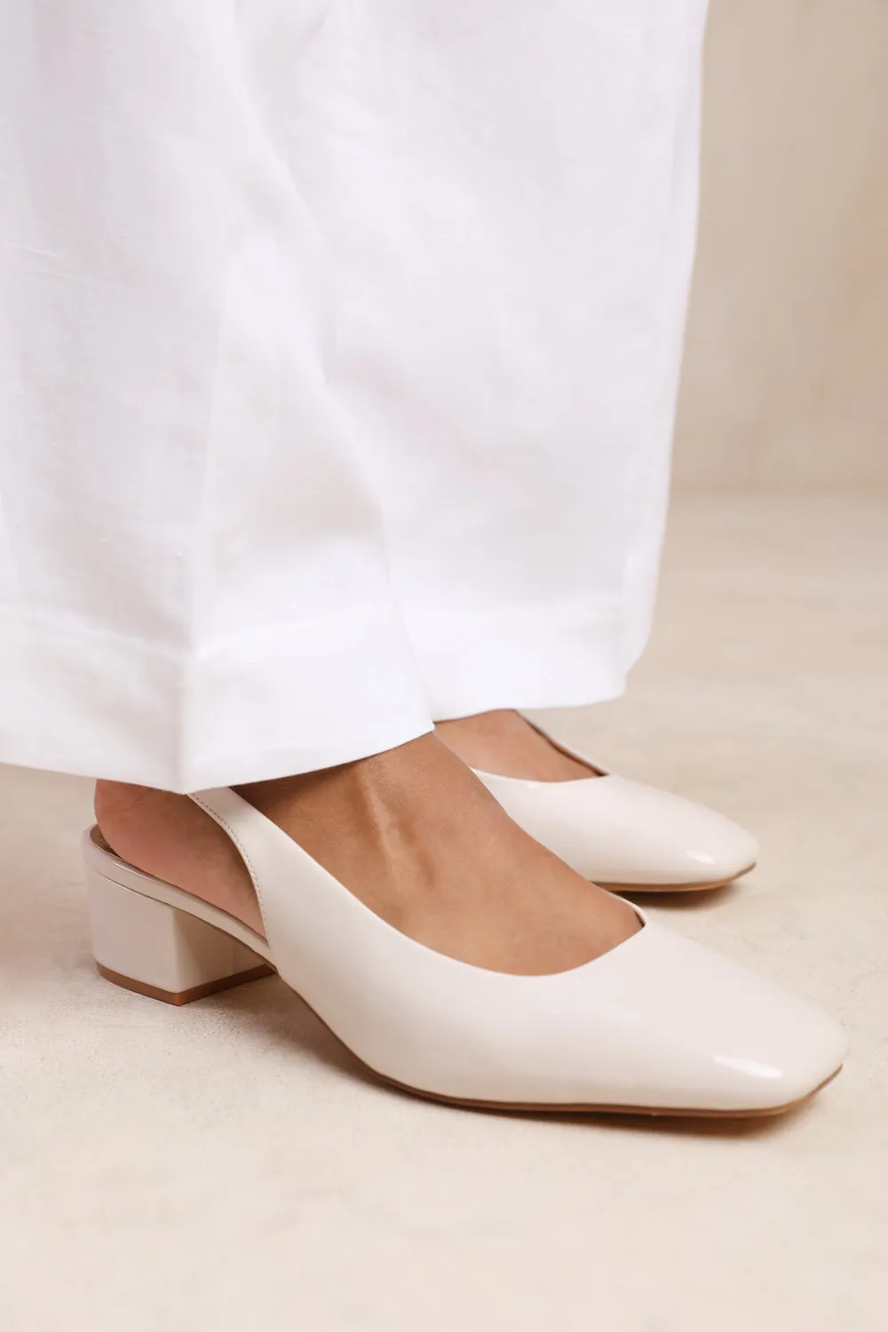 MICHIGAN SQUARE TOE SLING BACK LOW BLOCK HEELS IN CREAM PATENT